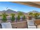 Outdoor patio with seating area offering views of the desert mountains at 305 Rezzo St, Las Vegas, NV 89138