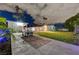 Expansive backyard with ping pong table, volleyball net, lush lawn, and covered patio for outdoor entertainment at 3175 S Torrey Pines Dr, Las Vegas, NV 89146
