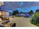 Spacious backyard featuring a ping pong table, a volleyball net, and comfortable seating area at 3175 S Torrey Pines Dr, Las Vegas, NV 89146