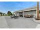 Spacious backyard with outdoor kitchen, dining, and lounge areas, ideal for entertaining guests at 3175 S Torrey Pines Dr, Las Vegas, NV 89146