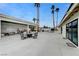 Expansive backyard featuring a pool, palm trees, and outdoor seating areas perfect for relaxation at 3175 S Torrey Pines Dr, Las Vegas, NV 89146