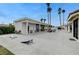 Spacious backyard featuring outdoor lounging, covered structure, and meticulously maintained landscaping at 3175 S Torrey Pines Dr, Las Vegas, NV 89146