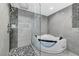 Luxurious bathroom showcasing a frameless glass shower and modern soaking tub at 3175 S Torrey Pines Dr, Las Vegas, NV 89146