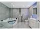 Well-lit bathroom features a modern tub, glass shower, and elegant fixtures at 3175 S Torrey Pines Dr, Las Vegas, NV 89146