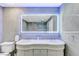Bright bathroom showcasing double sinks, a lighted mirror, and tile walls at 3175 S Torrey Pines Dr, Las Vegas, NV 89146