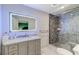 Contemporary bathroom with a sleek vanity, illuminated mirror, and a glass-enclosed shower at 3175 S Torrey Pines Dr, Las Vegas, NV 89146