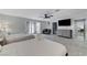 Bright bedroom showcasing two beds, seating area, and tile floors at 3175 S Torrey Pines Dr, Las Vegas, NV 89146