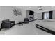 An elegant bedroom featuring a stone fireplace, two beds and black leather chairs at 3175 S Torrey Pines Dr, Las Vegas, NV 89146