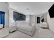 Bright bedroom showcasing white linens, modern lighting, and a TV for added convenience at 3175 S Torrey Pines Dr, Las Vegas, NV 89146