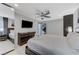Bright bedroom showcasing a well-appointed bed, contemporary dresser, and mounted television at 3175 S Torrey Pines Dr, Las Vegas, NV 89146