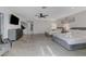 Spacious bedroom features two beds, modern decor, and seamless tile flooring at 3175 S Torrey Pines Dr, Las Vegas, NV 89146
