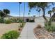 Stunning single-story home featuring mature landscaping, a circular driveway, and a symmetrical facade at 3175 S Torrey Pines Dr, Las Vegas, NV 89146