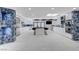 Gourmet kitchen with white cabinets, a large island, stainless steel appliances, and blue stone backsplash at 3175 S Torrey Pines Dr, Las Vegas, NV 89146