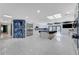 Bright open kitchen with stainless steel appliances, island with bar stools, and stylish stone accents at 3175 S Torrey Pines Dr, Las Vegas, NV 89146