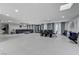 Large living area with tile flooring, elegant curtains, and a comfortable sectional sofa at 3175 S Torrey Pines Dr, Las Vegas, NV 89146