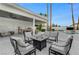 Relaxing outdoor living area with a fire pit, covered seating, and a view of the refreshing pool at 3175 S Torrey Pines Dr, Las Vegas, NV 89146