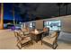Cozy outdoor living space with a fire pit and comfortable seating, perfect for enjoying cool evenings by the pool at 3175 S Torrey Pines Dr, Las Vegas, NV 89146