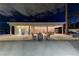 Expansive pool area featuring a covered lounge area, modern bathrooms, and multiple seating options at 3175 S Torrey Pines Dr, Las Vegas, NV 89146