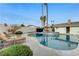 Inviting pool area featuring a pristine pool, comfortable lounge chairs, and lush landscaping at 3175 S Torrey Pines Dr, Las Vegas, NV 89146
