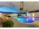 Beautiful backyard featuring a sparkling pool, spa, and lush landscaping, creating a private oasis at 3175 S Torrey Pines Dr, Las Vegas, NV 89146