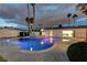 Stunning pool with a spa, set against a landscaped backyard; perfect for relaxing or entertaining at 3175 S Torrey Pines Dr, Las Vegas, NV 89146