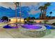 Luxurious backyard with a sparkling pool, raised spa, and covered outdoor living space at 3175 S Torrey Pines Dr, Las Vegas, NV 89146