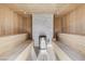 Inviting wooden sauna featuring seating on either side and a stone-accented heater for ultimate relaxation at 3175 S Torrey Pines Dr, Las Vegas, NV 89146