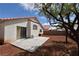 Backyard featuring a patio perfect for outdoor dining and low maintenance desert landscaping at 343 Dune Ridge Ave, North Las Vegas, NV 89031
