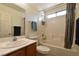 Cozy bathroom with a combination shower and tub, vanity, and a framed mirror at 343 Dune Ridge Ave, North Las Vegas, NV 89031