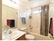 Bathroom with shower-tub combination with a shower curtain and vanity with storage at 343 Dune Ridge Ave, North Las Vegas, NV 89031