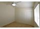 A bright bedroom features a ceiling fan and a closet with sliding doors at 343 Dune Ridge Ave, North Las Vegas, NV 89031