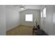 Bright bedroom with a ceiling fan, carpet, and three windows at 343 Dune Ridge Ave, North Las Vegas, NV 89031