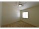 A neutral bedroom features a ceiling fan and a closet with sliding doors at 343 Dune Ridge Ave, North Las Vegas, NV 89031