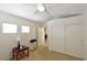 Bedroom includes bright windows, a ceiling fan and sliding door closet at 343 Dune Ridge Ave, North Las Vegas, NV 89031
