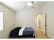 Bedroom featuring a ceiling fan and a door to another room at 343 Dune Ridge Ave, North Las Vegas, NV 89031