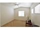 Bedroom with neutral walls, carpet and includes a ceiling fan and bright windows at 343 Dune Ridge Ave, North Las Vegas, NV 89031