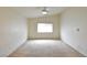 Spacious bedroom with neutral carpet, ceiling fan, and a window with blinds at 343 Dune Ridge Ave, North Las Vegas, NV 89031