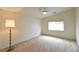 Spacious bedroom with neutral carpet, ceiling fan, and a window with blinds at 343 Dune Ridge Ave, North Las Vegas, NV 89031