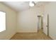 Neutral bedroom with carpet and a ceiling fan adjacent to the bathroom at 343 Dune Ridge Ave, North Las Vegas, NV 89031