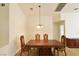 Formal dining area with wooden furniture and a unique chandelier at 343 Dune Ridge Ave, North Las Vegas, NV 89031