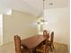 Traditional dining room features a wooden table and ornate chairs under a chandelier at 343 Dune Ridge Ave, North Las Vegas, NV 89031