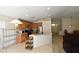 Bright kitchen with wooden cabinets, stainless steel appliances, and a breakfast bar at 343 Dune Ridge Ave, North Las Vegas, NV 89031