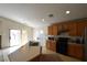 Functional kitchen space with black appliances, light wood cabinets, and a breakfast bar at 343 Dune Ridge Ave, North Las Vegas, NV 89031