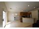 Open-concept living area with natural light, seamlessly flowing into the kitchen space at 343 Dune Ridge Ave, North Las Vegas, NV 89031