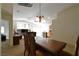 Bright, open living space featuring modern lighting and seamlessly connecting to the dining area at 343 Dune Ridge Ave, North Las Vegas, NV 89031