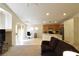 Bright open-concept living space with a kitchen area and comfortable seating at 343 Dune Ridge Ave, North Las Vegas, NV 89031
