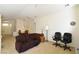 Spacious living area flowing into the dining space with neutral carpet and lots of light at 343 Dune Ridge Ave, North Las Vegas, NV 89031