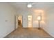 Neutral bedroom with ceiling fan, leading to bathroom and dining area at 343 Dune Ridge Ave, North Las Vegas, NV 89031