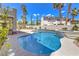 Beautiful backyard pool and spa with lush landscaping and a view of the home's exterior at 3552 Coventry Gardens Dr, Las Vegas, NV 89135