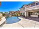 Stunning backyard with pool, spa, patio, and lush landscaping, perfect for entertaining at 3552 Coventry Gardens Dr, Las Vegas, NV 89135